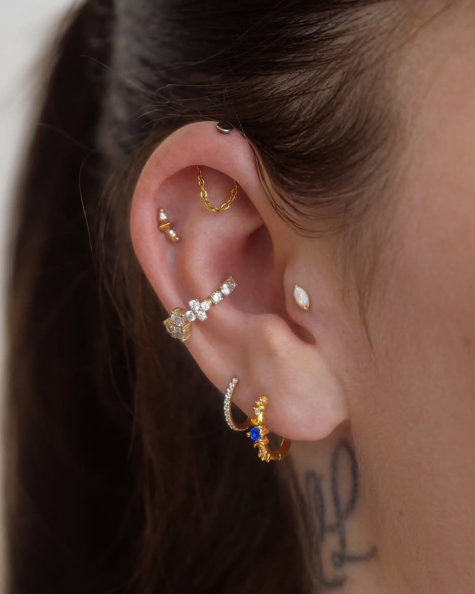 Compo' piercing dorée réalisé par Marion